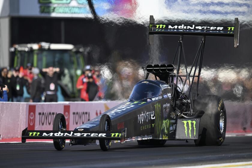 In this photo provided by the NHRA, Top Fuel pilot Brittany Force closes out qualifying at In-N-Out Burger Pomona Dragstrip for the In-N-Out Burger NHRA Finals auto races in Pomona, Calif., Saturday, Nov. 16, 2024. (Marc Gewertz/NHRA via AP)