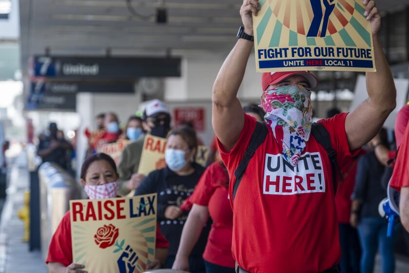 LOS ANGELES, CA - SEPTEMBER 14: Members of UniteHere Local 11, a union with 30,000 Southern California members who work in hotels, stadiums, convention centers and airport concessions protests at Los Angeles International Airport on Tuesday, Sept. 14, 2021 in Los Angeles, CA. (Francine Orr / Los Angeles Times)