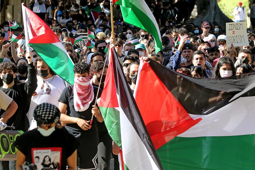 Los Angeles, CA - Students march across the UCLA campus in support of Palestinians caught up in the conflict that continued to rage unabated between Palestinians and Israelis in the Middle East on Thursday, Oct. 12, 2023. The two peoples have been in a constant state of war for 75 years. (Luis Sinco / Los Angeles Times)