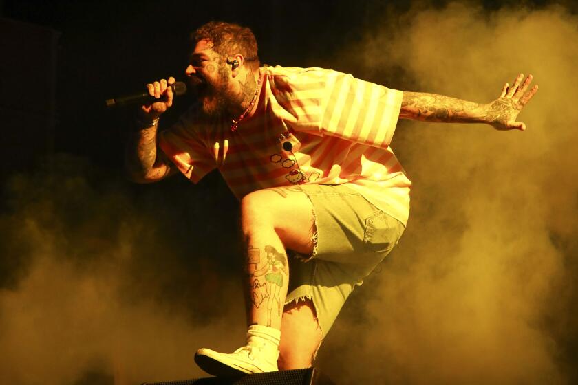 Musician Post Malone performs at the 2021 Governors Ball music festival at Citi Field on Sunday, Sept. 26, 2021, in New York. (Photo by Andy Kropa/Invision/AP)