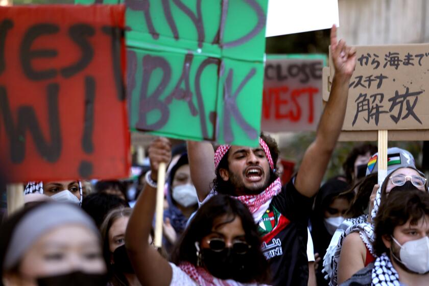 WESTWOOD, CA - NOVEMBER 19, 2024 - - Over 150 pro-Palestinian students march to demand UCLA divest in Israel over the war in Gaza on the campus in Westwood on November 16, 2024. The students were also protesting to support a strike by American Federation of State, County and Municipal Employees union (AFSCME 3299) that is planning to start tomorrow. (Genaro Molina/Los Angeles Times)