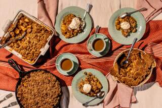 LOS ANGELES, CA - OCTOBER 30: A tablescape with three apple crisps with different toppings in Los Angeles, CA. (Catherine Dzilenski / For The Times)