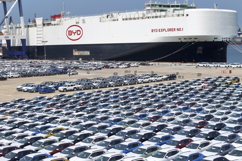 BYD's first car carrier ''BYD Explorer 1'' is loading cars for export at Yantai Port in Yantai, Shandong province, China, on July 5, 2024. According to the data of the General Administration of Customs organized by the China Association of Automobile Manufacturers, in the first five months of this year, China's total vehicle exports are reaching 2.446 million, an increase of 26.6%; exports are reaching 46.43 billion US dollars, up 19.9 percent year on year. (Photo by Costfoto/NurPhoto via AP)