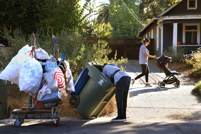 PASADENA-CA-OCTOBER 24, 2024: Gualberta Dominguez, 73, collects cans in a Pasadena neighborhood on October 24, 2024. (Christina House / Los Angeles Times)