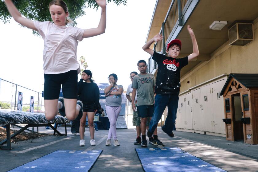 Los Angeles, CA - July 08: Students engage in a jumping acticity during an Los Angeles Unified School District free summer program at Monte Vista Street Elementary School on Monday, July 8, 2024 in Los Angeles, CA. (Dania Maxwell / Los Angeles Times)