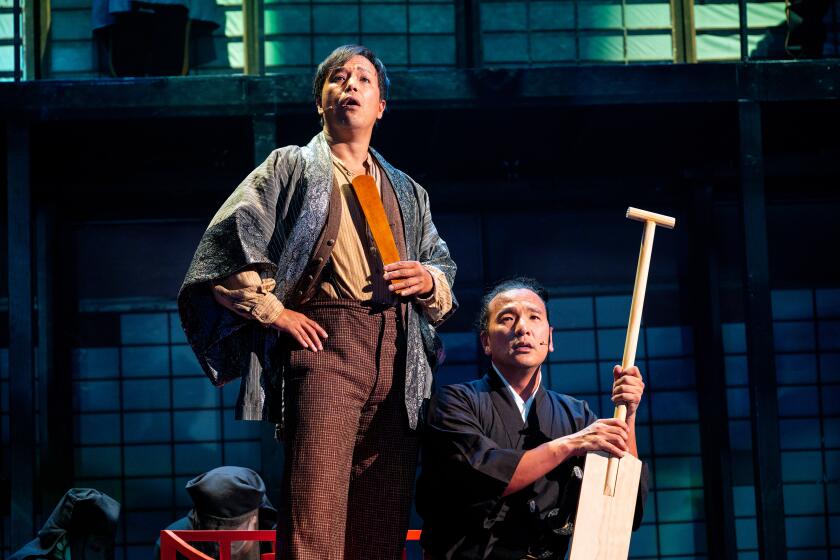 Adam Kaokept as Manjiro (left) and Brian Kim McCormick as Kayama (right) in Pacific Overtures at East West Players. Photo by Teolindo.