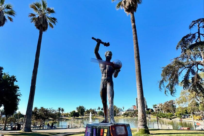 L.A. artists S.C. Mero and 'Wild Life' added a drug pipe to the Prometheus statue in MacArthur Park.