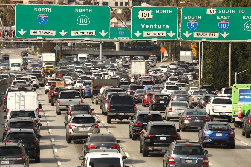 Los Angeles, California-June 15, 2021-Traffic has returned to Los Angeles. Rush hour at the intersection of the 110 and 101 freeways on June 15, 2021. (Carolyn Cole / Los Angeles Times)