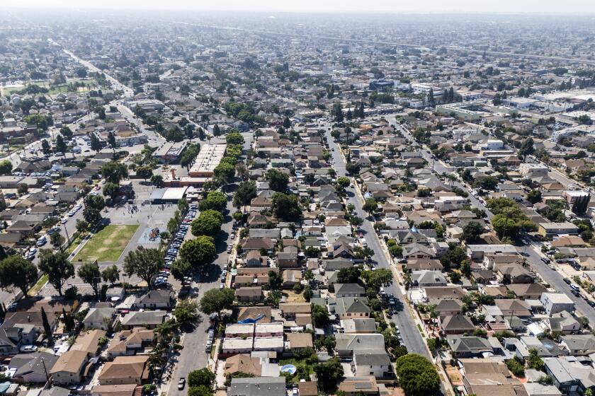 LOS ANGELES, CA - SEPTEMBER 26: Los Angeles is on the verge of redrafting blueprints for its neighborhoods to accommodate more than 250,000 new homes. But under a recommendation from the planning department, nearly three quarters of the city will remain off limits to further growth. Photographed at Historic South Central in Los Angeles, CA on Thursday, Sept. 26, 2024. (Myung J. Chun / Los Angeles Times)