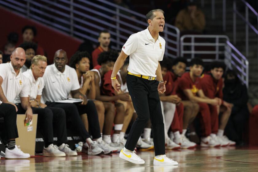 USC men's basketball coach Eric Musselman shouts from the sideline during a game earlier this season against Idaho State