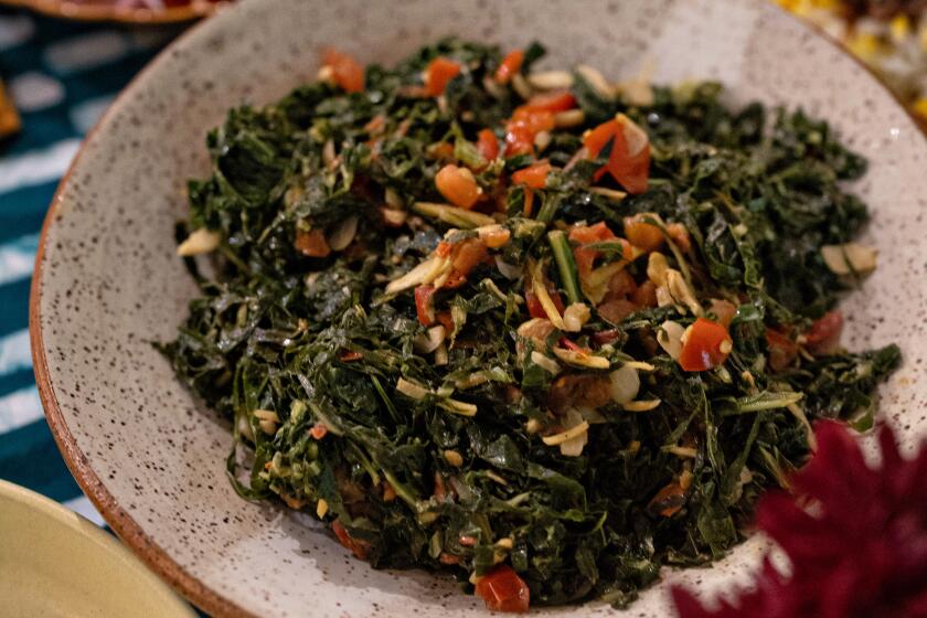 Kiano Moju make sukuma wiki (collard greens).