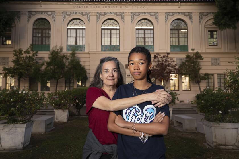 Studio City, CA - October 31: Walter Reed Middle School on Thursday, Oct. 31, 2024 in Studio City, CA. Chloe Kouame-Waldman, a 7th grader at Walter Reed Middle School in Studio City with her mom, Elaine Waldman. L.A. Unified is relaxing the admissions policy for a rigorous academic program at two middle schools, igniting a heated debate over how to ensure equitable access to initiatives for highly gifted students. (Al Seib / For The Times)