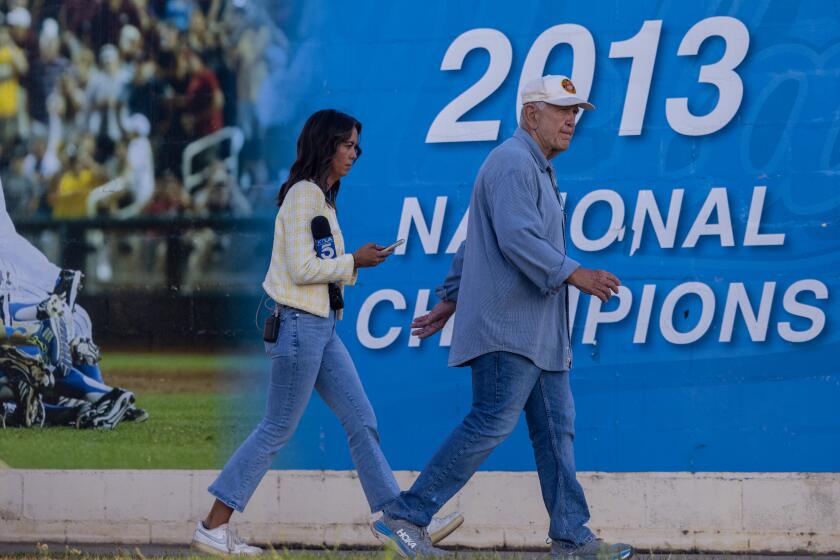 West Los Angeles, CA - August 21: U.S. District Judge David O. Carter, right, tours Jackie Robinson Stadium on Wednesday, Aug. 21, 2024 in West Los Angeles, CA. The stadium is on land leased from the VA and a lawsuit alleges that the Department of Veterans Affairs has illegally leased veteran land. (Brian van der Brug / Los Angeles Times)