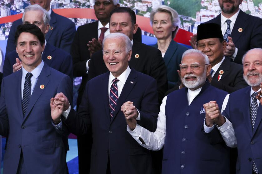 U.S. President Joe Biden, Indian Prime Minister Narendra Modi, Canada's Prime Minister Justin Trudeau and Indian Prime Minister Narendra Modi react, as world leaders gather for a group photo during the G20 summit in Rio de Janeiro, Brazil, Tuesday, Nov. 19, 2024. (Leah Millis via AP, Pool)