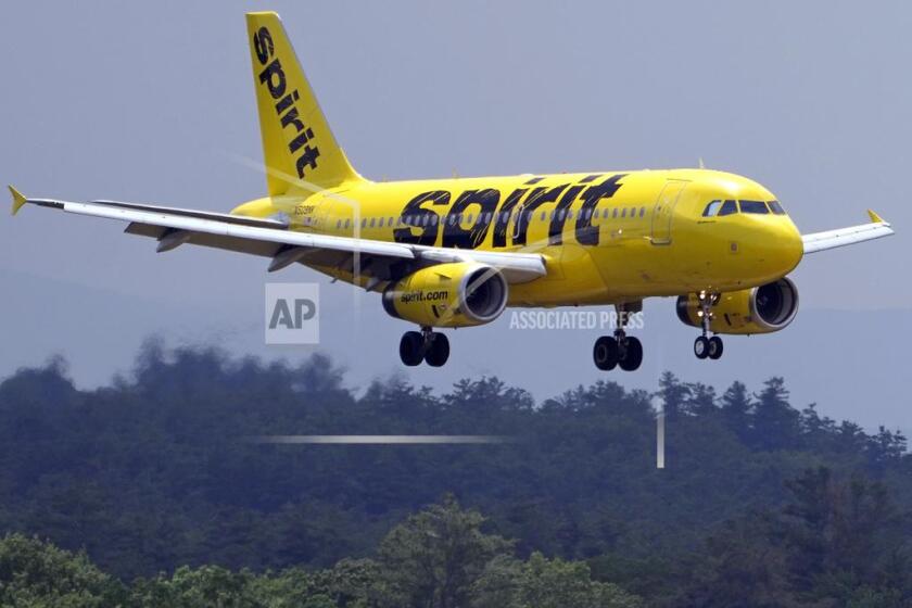 FILE - A Spirit Airlines 319 Airbus approaches Manchester Boston Regional Airport for a landing, Friday, June 2, 2023, in Manchester, N.H. (AP Photo/Charles Krupa, File)