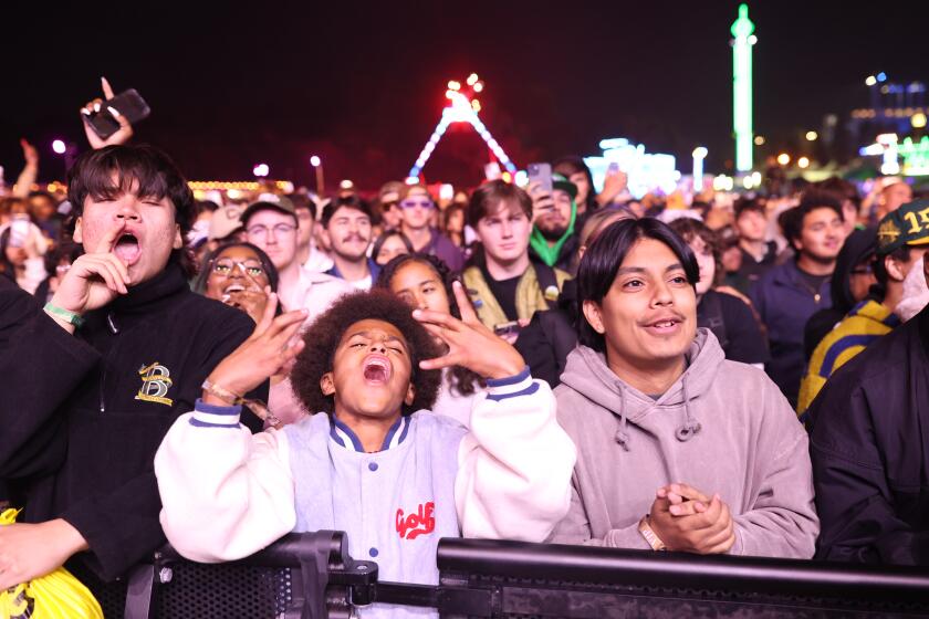 Los Angeles, CA - November 16: Audience members watch The Alchemist perform at Camp Flog Gnaw on Saturday, Nov. 16, 2024 in Los Angeles, CA. (Michael Blackshire / Los Angeles Times)