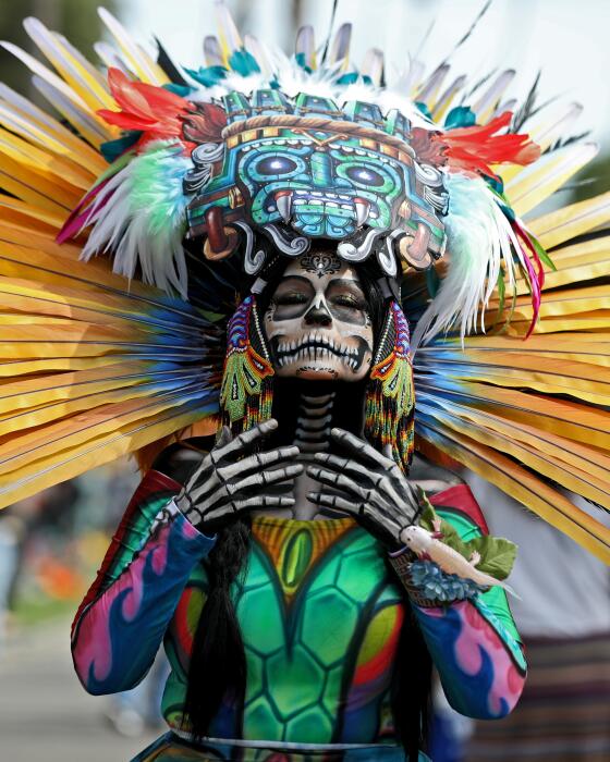 Maria Flores, 54 of Los Angeles, poses in her La Muerte Maria at the annual Hollywood Forever Cemetery Dia De Los Muertos event in Los Angeles on Saturday, Oct. 26, 2024.